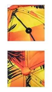Close-up of tropical orange baseball cap with palm tree print and embroidery detail