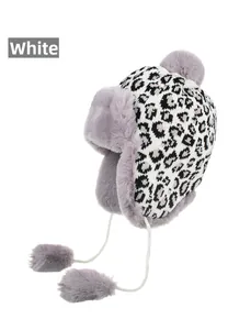 Detail view of the thick gray faux fur lining and leopard print on the winter trapper hat