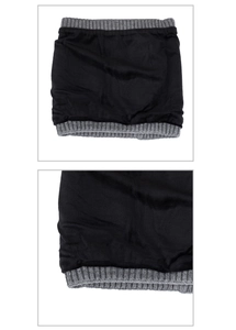Detail of black faux cashmere neck warmer with gray ribbed knit trim and warm thick texture