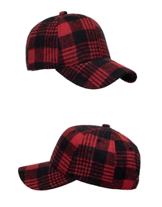 Detail of red and black buffalo check baseball cap with textured wool fabric