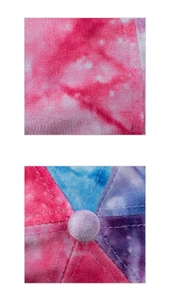 Detail of velvet tie-dye texture showing premium stitching and top button of skull cap