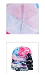 Detail of the inner mesh lining and adjustable metal buckle on tie-dye docker hats
