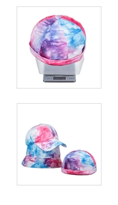Detail showing vintage tie-dye winter cap weight of 56.3g on a digital scale