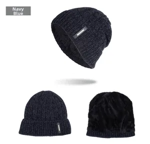 Detailed views of navy blue cable knit hat with warm black fleece lining and fashion label