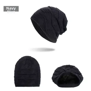 Detail view of navy blue knitted beanie featuring wave pattern and warm fleece lining inside