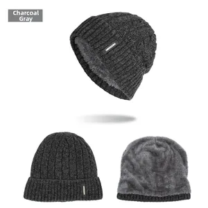Close-up of heather gray knit beanie featuring thick fleece lining and fashion leather label