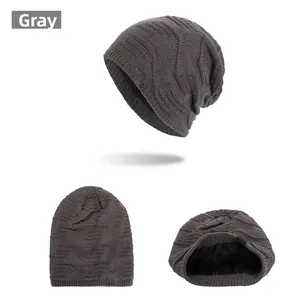 Detail of dark grey knit beanie featuring geometric texture and thick fleece lining