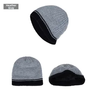 Detail view of the thick black fleece lining inside this grey knitted winter beanie