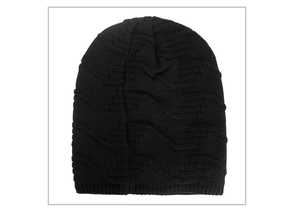 Detail of black knit beanie featuring thick textured rib patterns for winter warmth