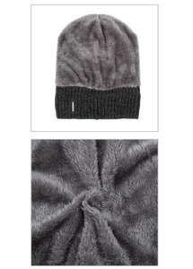 Detail of warm grey cable knit beanie with thick fleece lining and fashion label