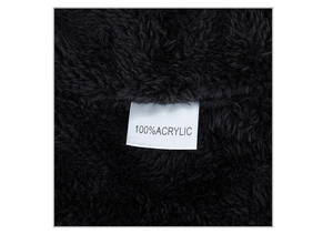 Detail showing 100% acrylic material texture and white wash label on the black knit hat