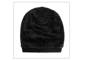 Detail of black knitted beanie showing thick thermal fleece lining and ribbed knit texture
