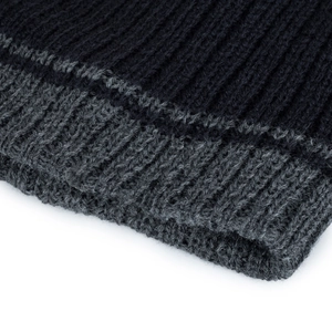 Vertical striped knit beanie hat in navy blue and grey colors with warm ribbed texture