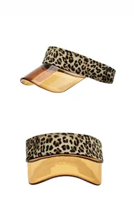 Detail showing leopard print headband and amber translucent plastic visor sun hat