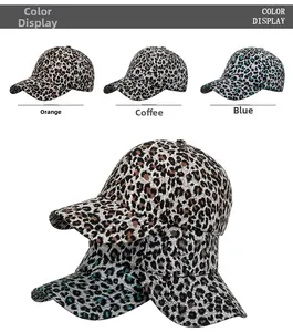 Detailed color display of orange, coffee, and blue leopard print baseball caps