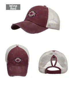 Detail view of wine red washed canvas baseball cap with mesh back and ponytail hole