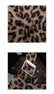 Detail view of leopard print baseball cap with adjustable metal buckle and top button