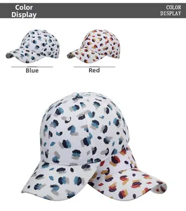 Detail view of splatter graffiti baseball caps in blue and red color options