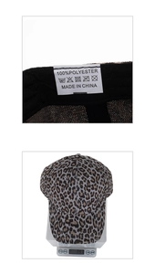 Macro detail of leopard print baseball cap washing label showing 100% polyester material