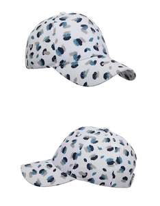 Detailed view of white baseball cap with blue splash ink graffiti and 6-panel structure