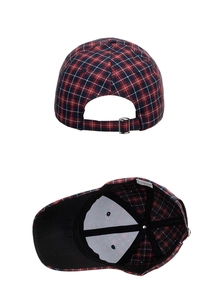Detail of red plaid baseball cap featuring adjustable metal buckle and inner structure