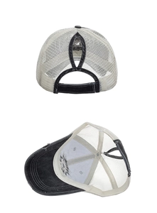 Detail view of the back ponytail hole opening on the washed mesh trucker baseball cap