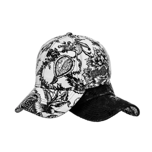 Classic baseball cap featuring a white black floral botanical print and solid black color