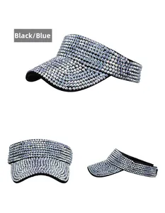 Detail view of rhinestone-studded sun visor hat in black and blue with sparkling finish