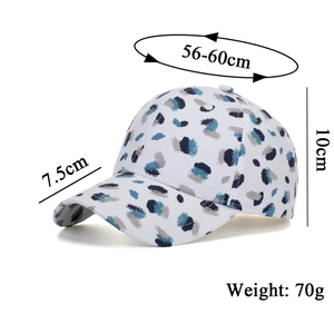 White baseball cap with blue graffiti splash pattern including size and weight specs
