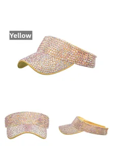Detail view of yellow sun visor hat with sparkling rhinestones for outdoor golf fashion