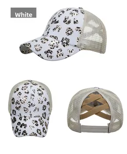 Detail of white ponytail baseball cap with gold leopard print and elastic crisscross back