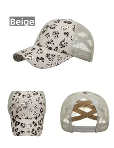 Detail showing the leopard print pattern and criss-cross ponytail hole on the beige cap