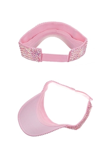 Detail of pink visor with rhinestone embellishments and adjustable strap closure