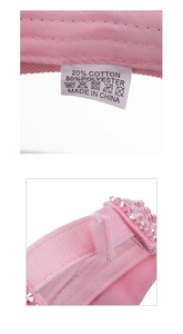 Detail of pink rhinestone cap with adjustable velcro strap and wash care label