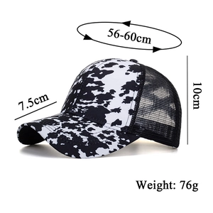 Side view of black and white cow print baseball cap with mesh back and size details