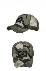 Detail view of jungle camouflage trucker hat featuring breathable mesh and velcro patch