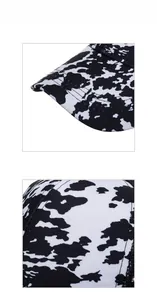 Detailed close-up showing cow print pattern and breathable black mesh on the baseball cap