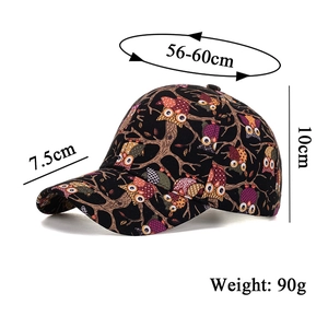 Detail view of cotton baseball cap featuring colorful owl prints and size specifications