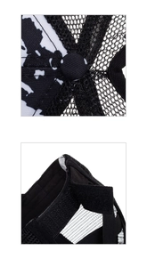 Detail of black and white striped sun hat showing mesh structure and adjustable strap
