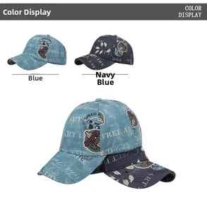 Detail view of washed denim baseball caps with vintage graffiti and floral print