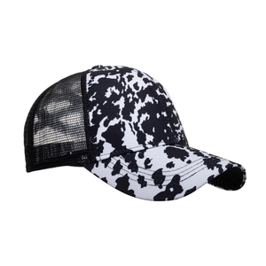 Classic cow print trucker hat with black breathable mesh back and curved visor design
