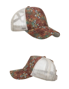 Detail view of baseball cap featuring cross sunflower print and white mesh back