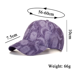 Detail of purple baseball cap with embossed tulip texture and adjustable buckle design