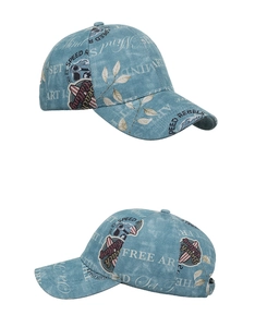 Detailed close-up showing the vintage light blue washed denim cap and its adjustable back strap