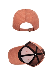 Detail view of coral pink baseball cap with ORR jacquard pattern and metal buckle adjustment