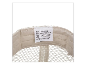 Close-up of internal fabric label showing 65% cotton blend and mesh trucker hat detail