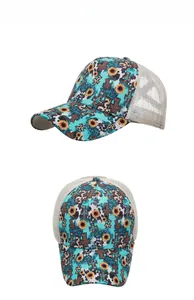 Detail of sunflower and cross print trucker hat with leopard patterns and white mesh back