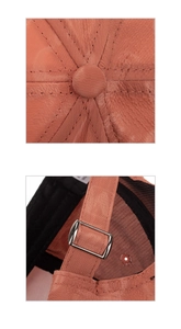 Detail of the vintage orange baseball cap showing fabric texture and adjustable metal buckle