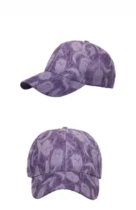 Vertical display of dark purple baseball cap with floral textured jacquard fabric