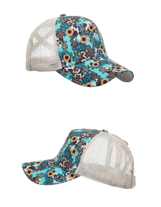 Detail view of turquoise trucker hat with sunflower cross print and breathable mesh back